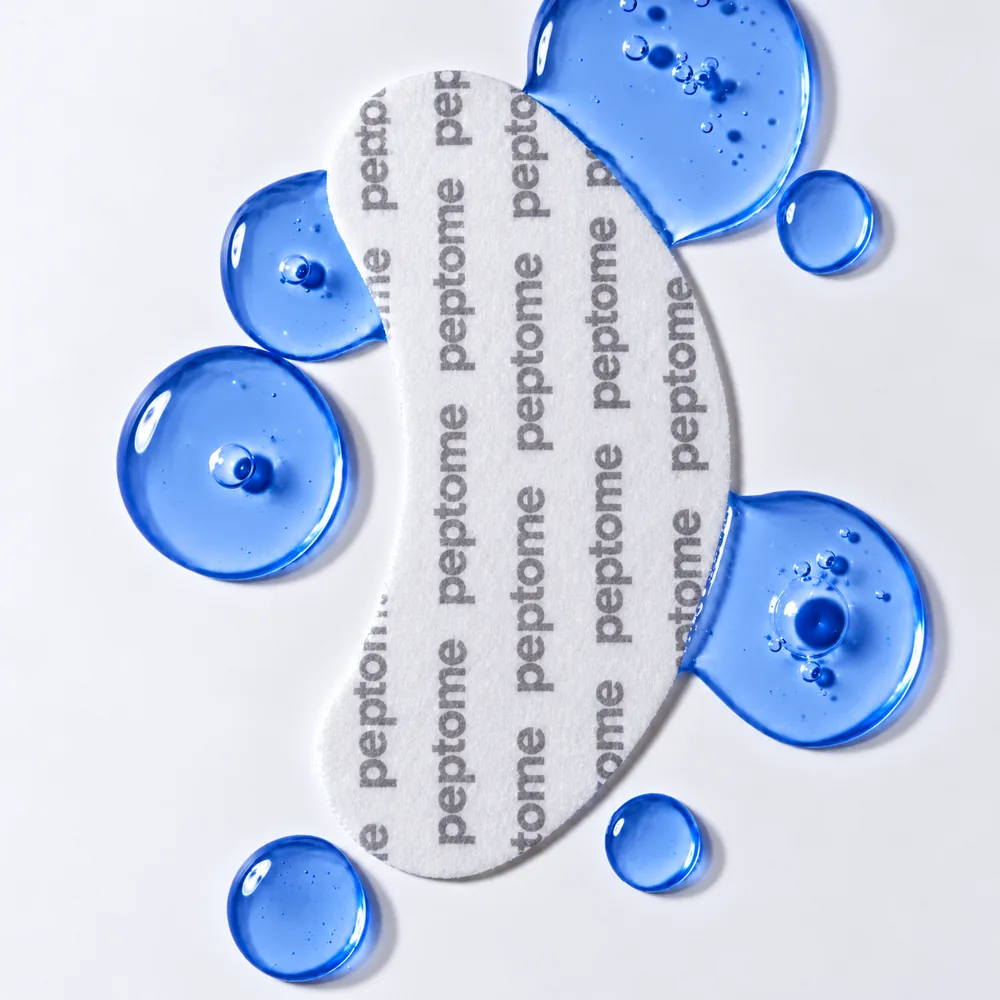 Drops of blue copper-peptide gel beside a Peptome patch